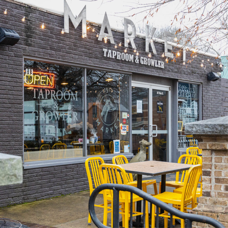 market taproom and growler front entrance with yellow seating