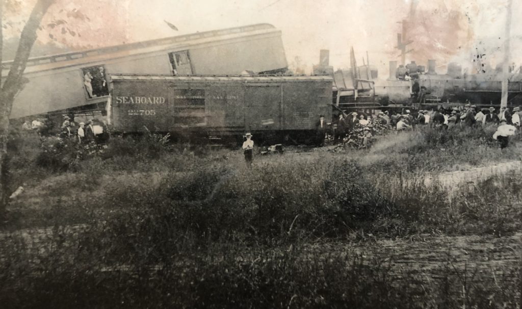 Train Wreck in Lilburn GA with man standing in front of trains
